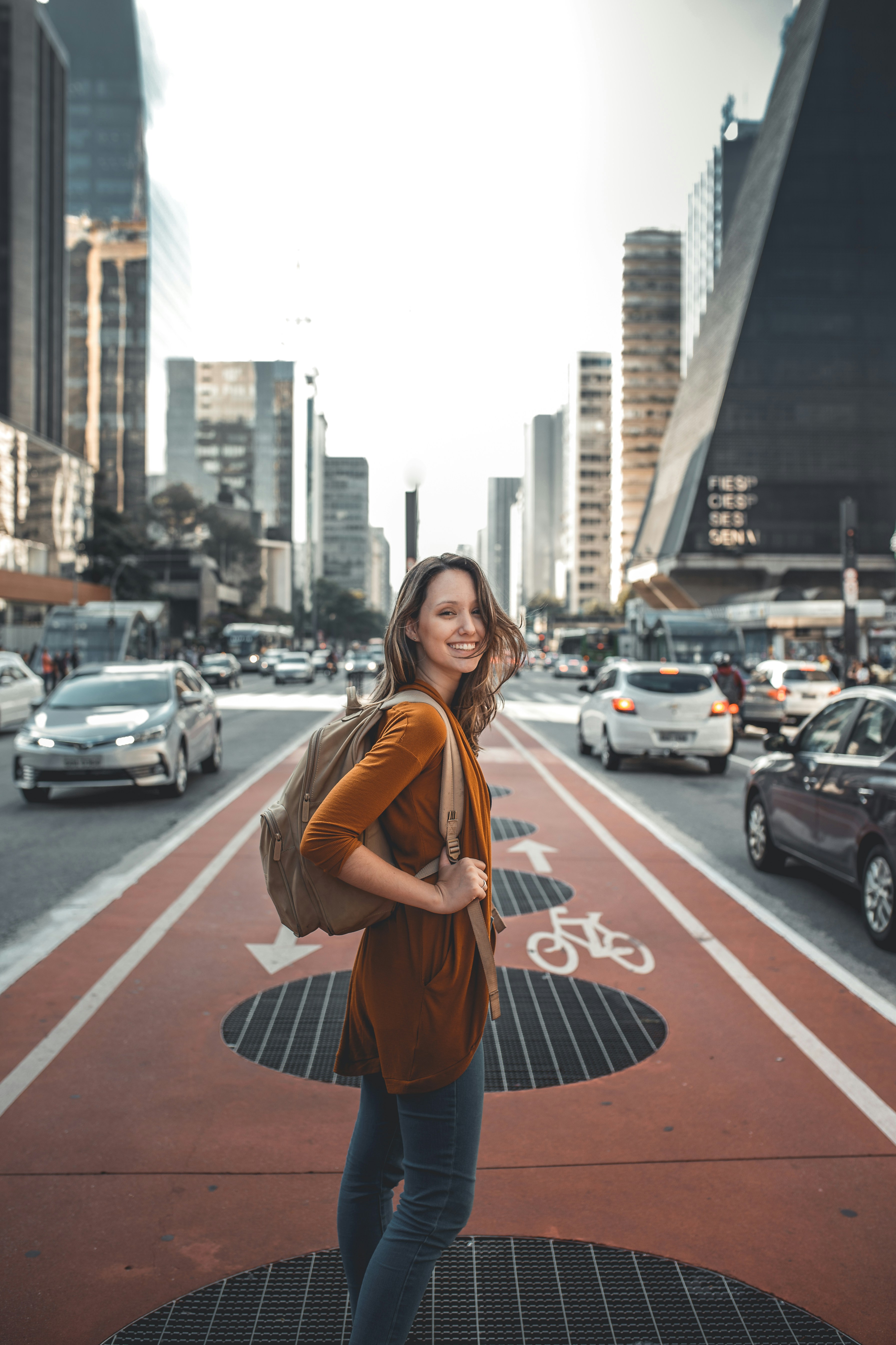 Woman with backpack travelling to a clinic abroad for IVF